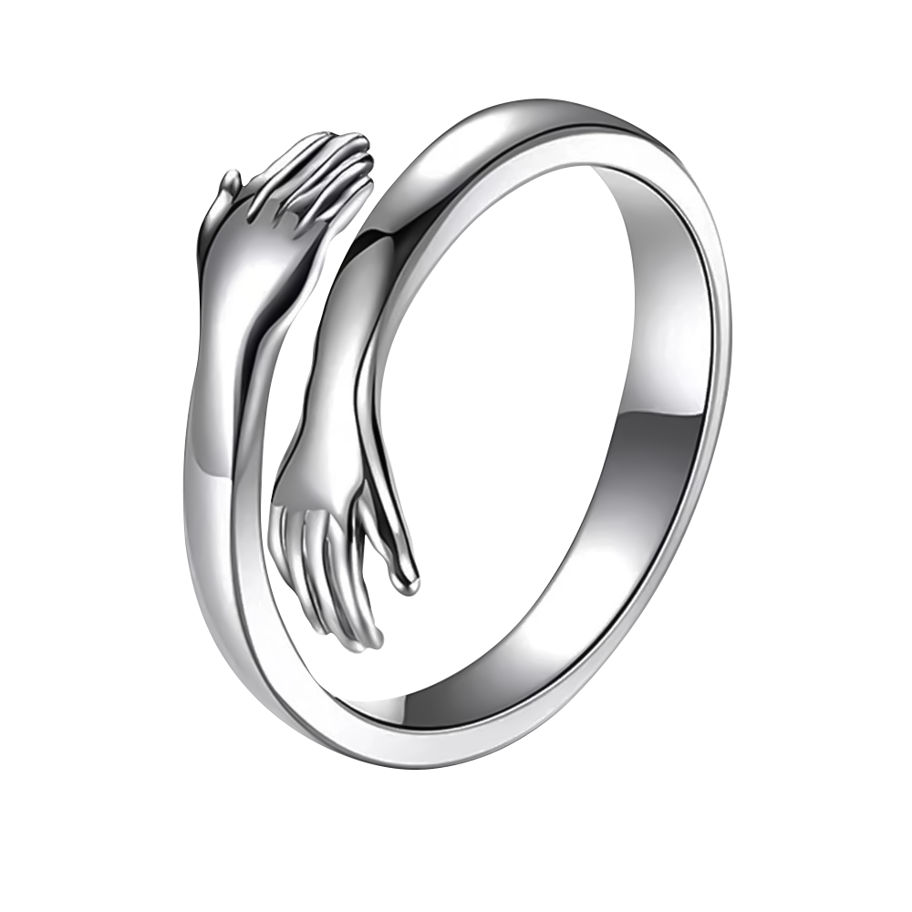 Een sterling zilveren ring met handen in een tedere omhelzing, die liefde en warmte symboliseert in een elegant ontwerp