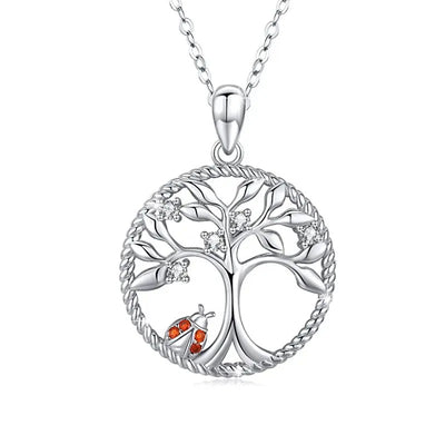 Sterling zilveren hanger met een gouden-bladerige familieboom, 'Family' gegraveerd, die blijvende banden symboliseert