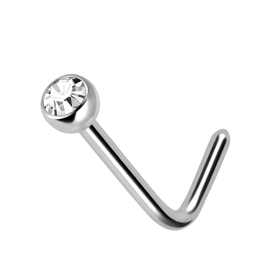 Een gepolijste titanium L-vormige pin met een 2mm heldere zirconia, werpt een delicate glinstering op het profiel van de drager
